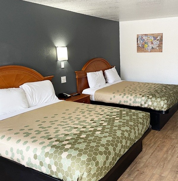 Two double beds room featuring license plate US map artwork